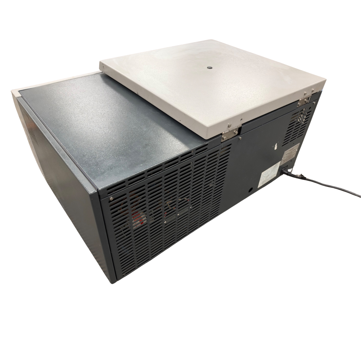 Rear side view of the Jouan CR4-22 centrifuge showing the power cord connection, metal casing, and cooling vents.