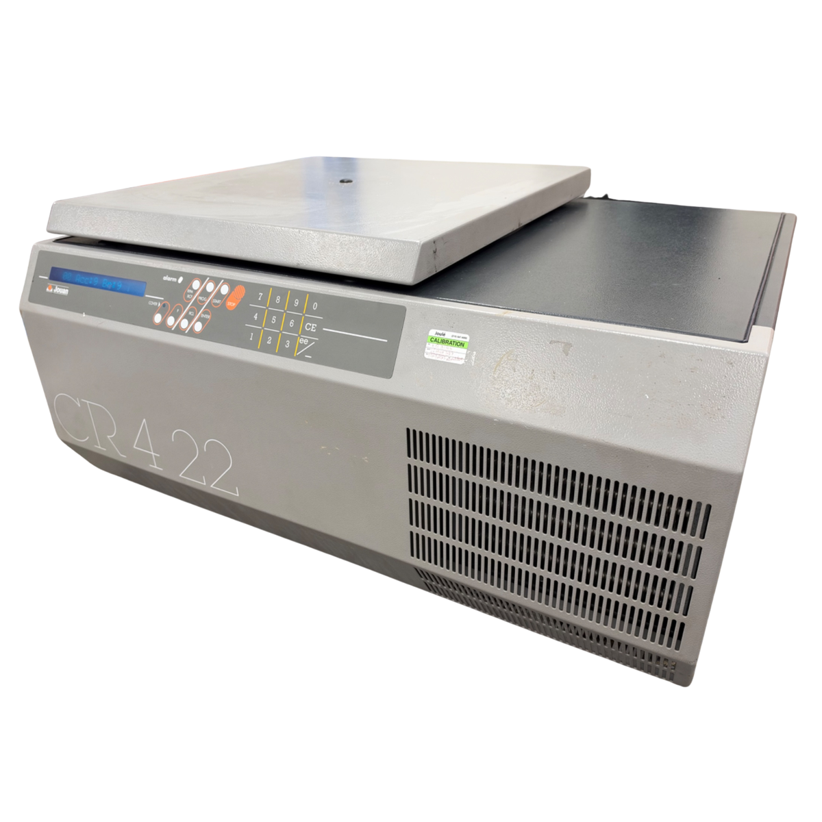 Angled front-right perspective of the Jouan CR4-22 benchtop centrifuge showing the front grille and calibration sticker.