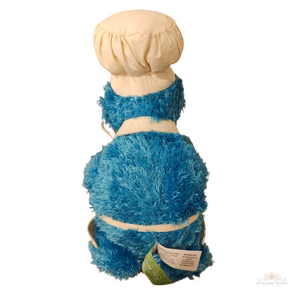 Back view of Cookie Monster plush doll wearing apron