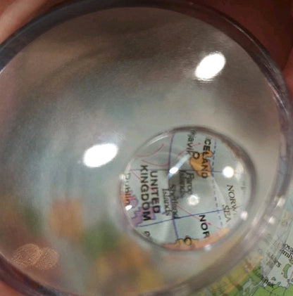 Close-up of world map details on educational desk globe