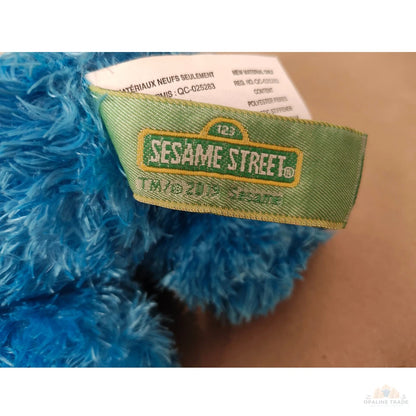 GUND brand tag on Cookie Monster plush toy