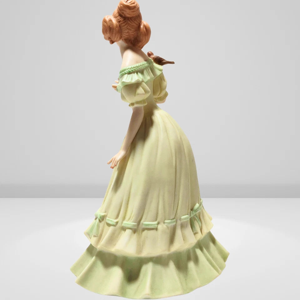 Side view of Victorian lady porcelain figurine detailed dress