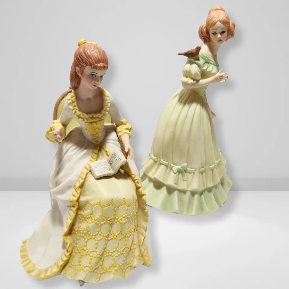 Vintage Victorian lady porcelain figurines pair reading lady and girl with bird