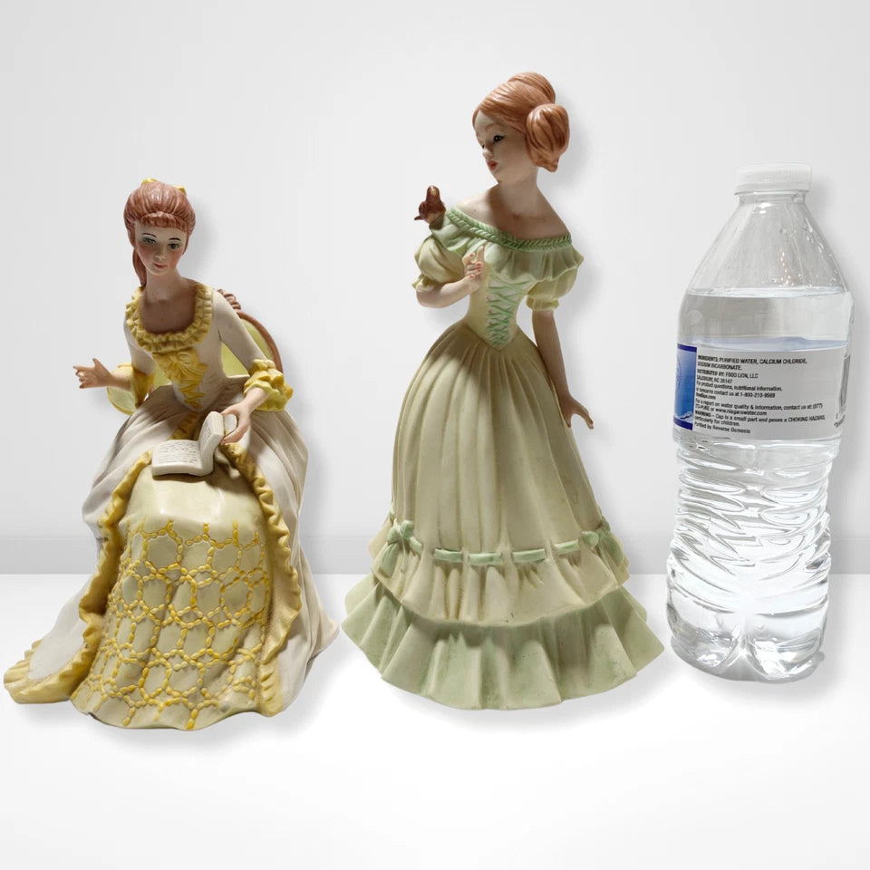 Vintage Victorian lady porcelain figurines pair reading lady and girl with bird