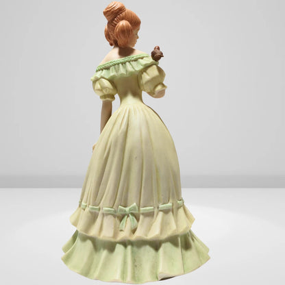Intricate dress details on Victorian porcelain lady figurine