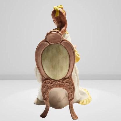 Back view of Victorian lady porcelain figurine detailed dress